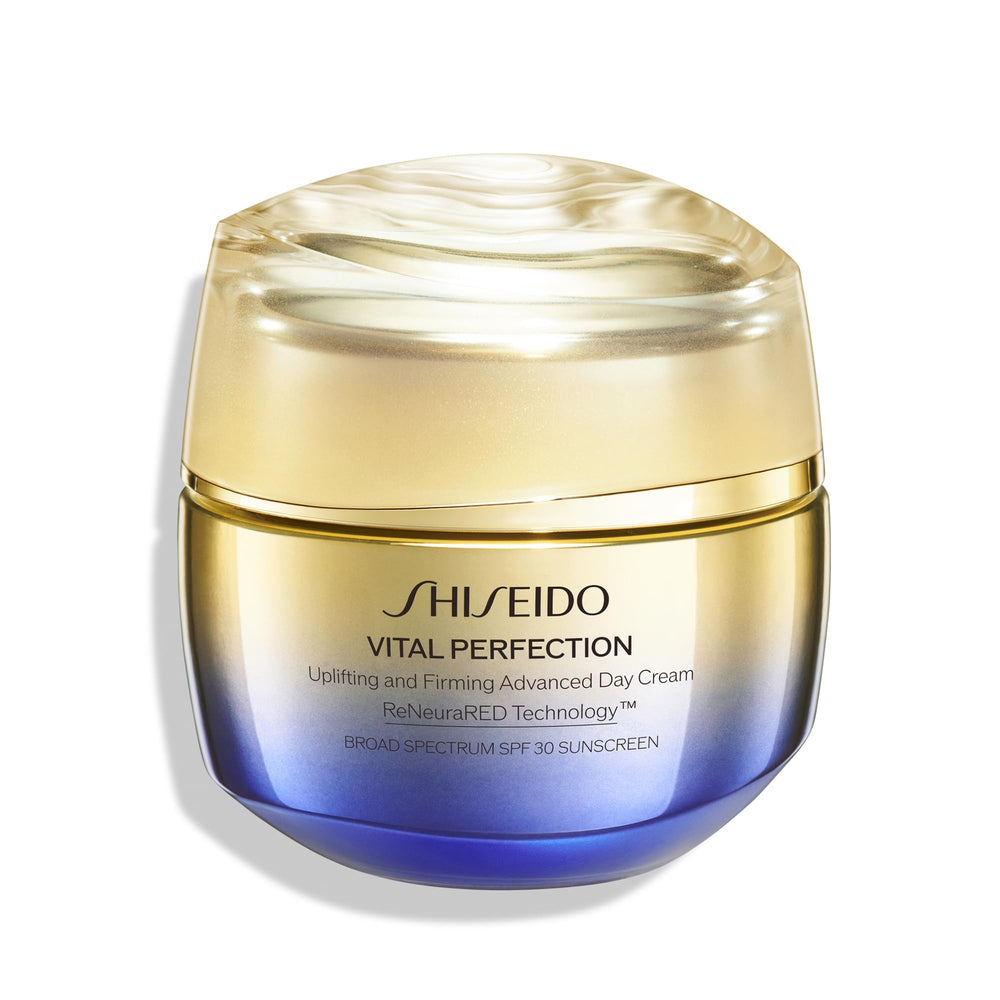 Shiseido Vital Perfection day cream jar close-up showing rich texture and radiant glow.