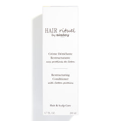 Shiny, soft hair after applying Sisley Paris Restructuring Conditioner.