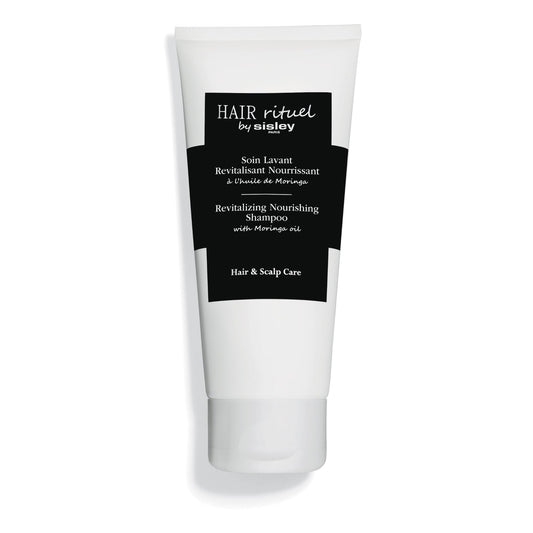 Sisley Paris Revitalizing Nourishing Shampoo bottle close-up for nourishing care