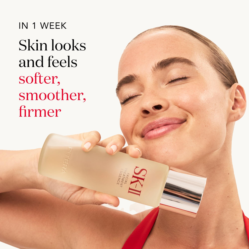 Patting SK-II Facial Treatment Essence onto the face to even texture and glow.