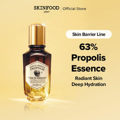 SKINFOOD 1957 Royal Honey Propolis Enrich Essence label close-up; premium ingredients for healthy-looking skin.