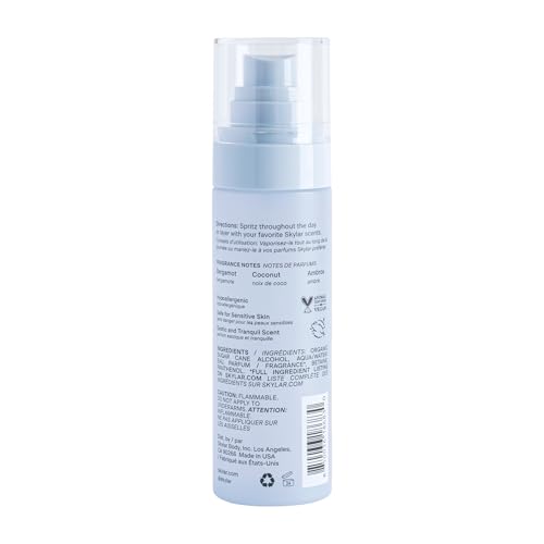 Skylar Coconut Cove spray in hand, on-the-go fragrance for travel.