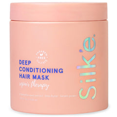 Sleek'e Silk'e Repair Therapy in use, applying mask for deep nourishment.