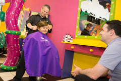 Child applying Snip-its Silly Slicker gel for easy shaping and control.