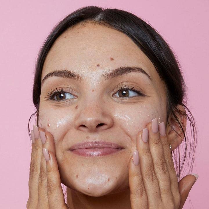 Soap & Glory exfoliating beads visible in action for gentle, non-abrasive cleansing.