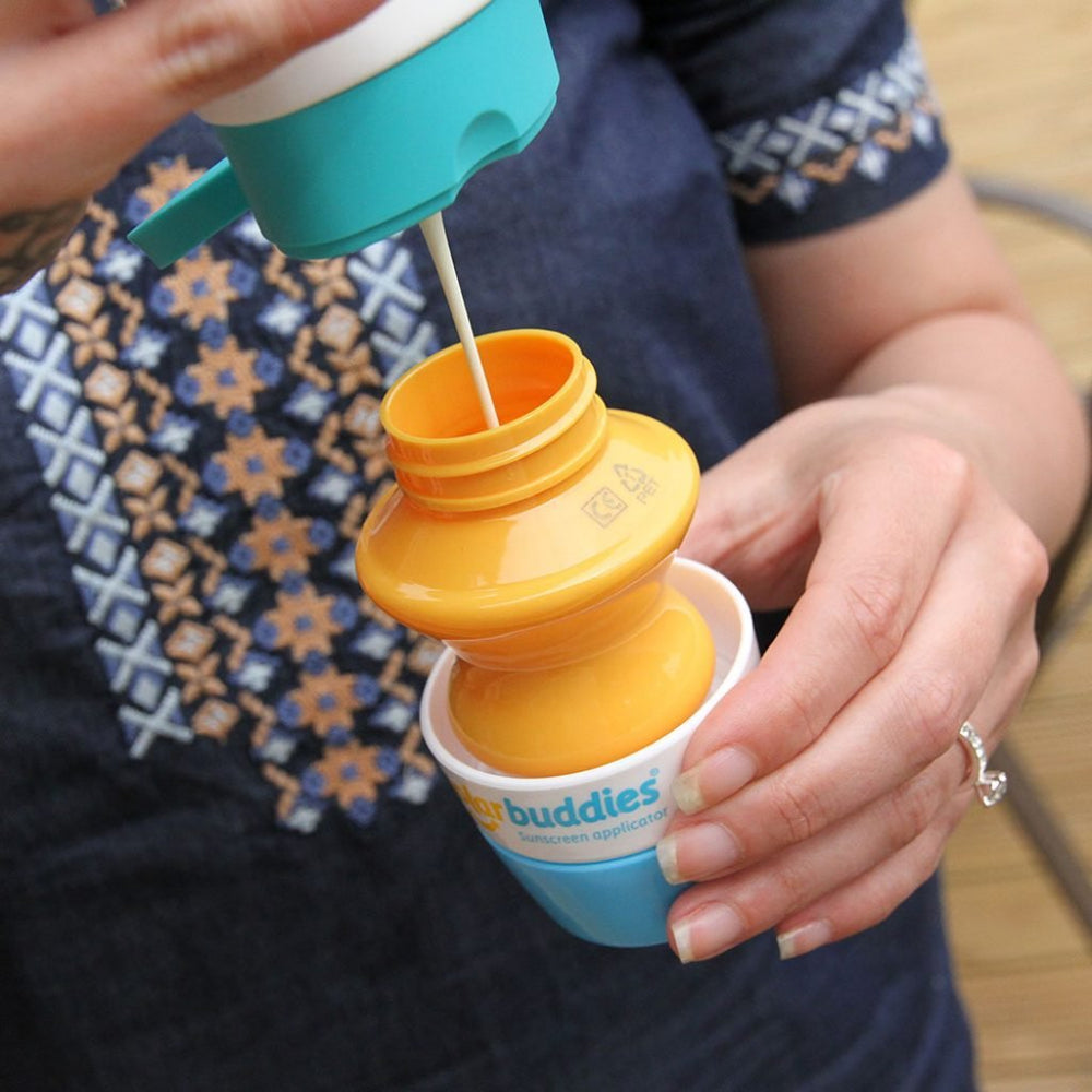 Solar Buddies Duo GB roll-on sponge applicator in-use showing quick lotion application for families
