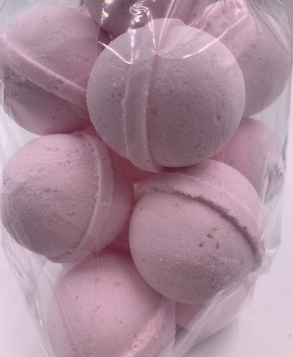 Spa Pure Pink Sugar Bath Bomb in a relaxing bath scene, offering a spa-like experience.