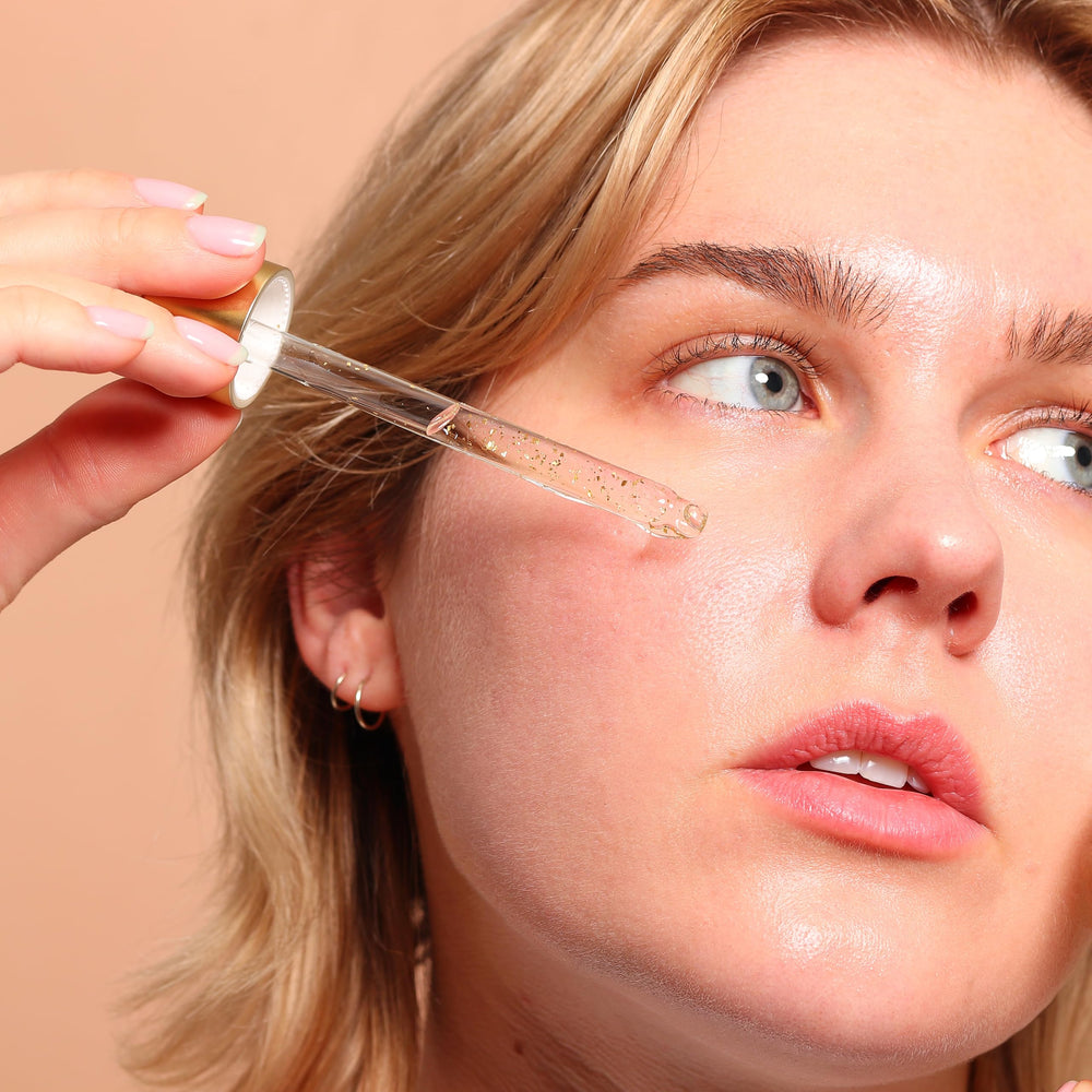 SpaLife 24K gold flakes closeup reveals luxe radiance and refined skin texture.