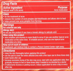 Applying Stridex pad to skin for quick cleansing