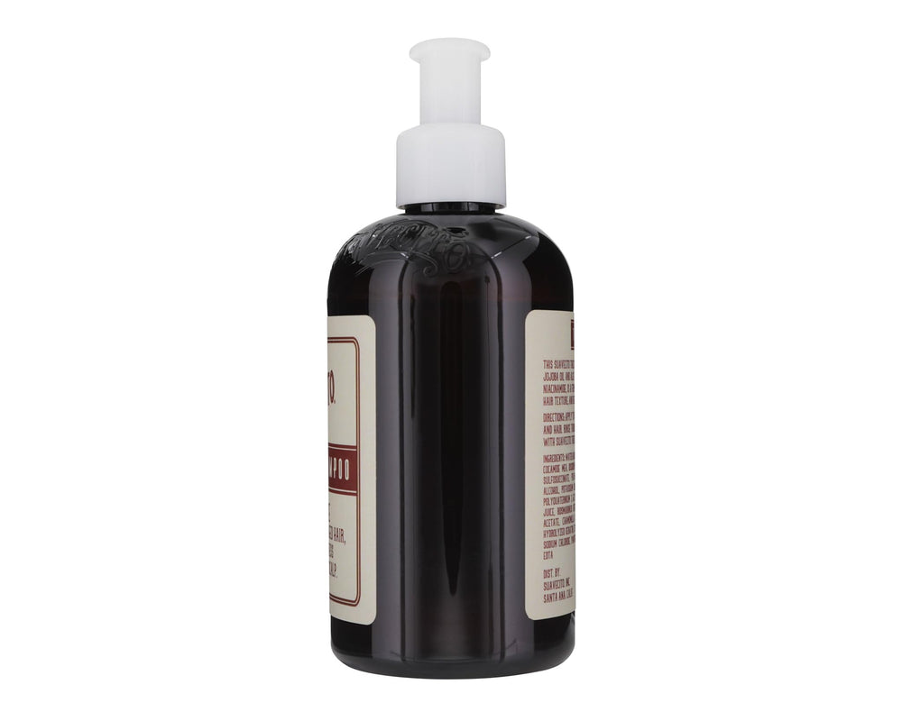 Suavecito thickening shampoo lather in a sink shows cleansing and volume-boost potential.