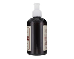 Suavecito thickening shampoo lather in a sink shows cleansing and volume-boost potential.