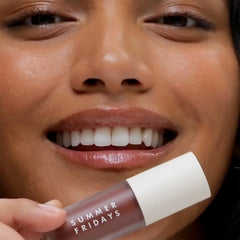 Summer Fridays Dream Lip Oil application glides on evenly for tinted hydration.