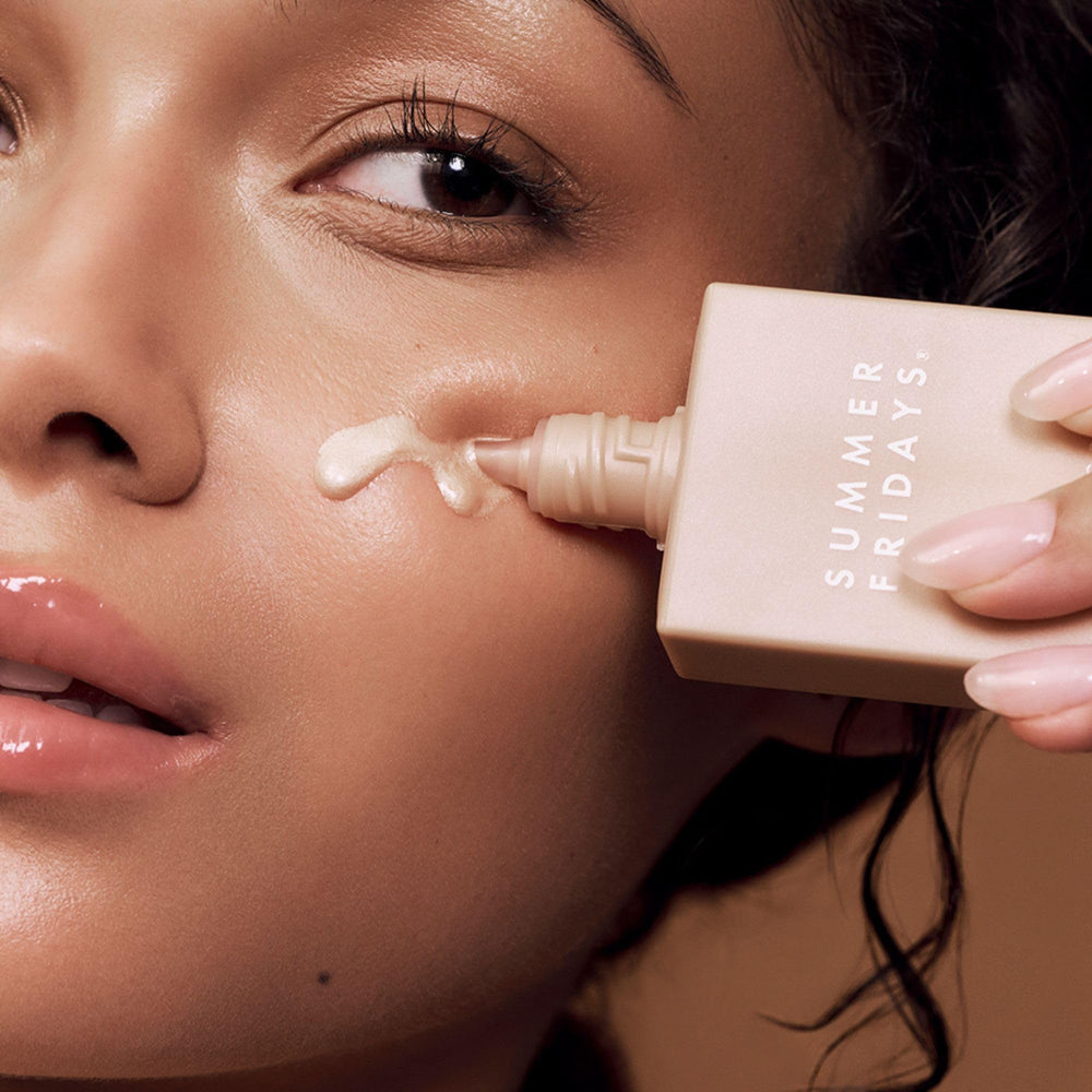 Summer Fridays Illuminating Drops applied on skin for a soft glow.