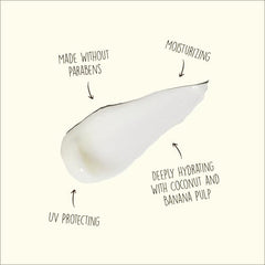 Close-up of shampoo ingredients highlighting coconut oil and banana benefits.