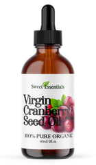 Sweet Essentials cranberry seed oil bottle shows pure, cold-pressed skin and hair nourishment.