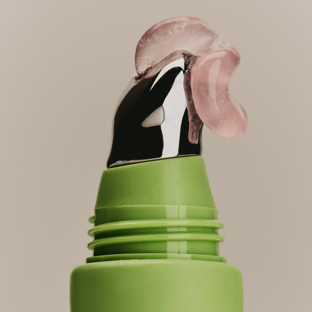 SWEET JULY SKIN Lip Treatment bottle open showing smooth lip application