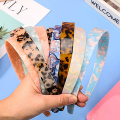 Syhood tortoise shell headband in leopard pattern adds bold flair to outfits.