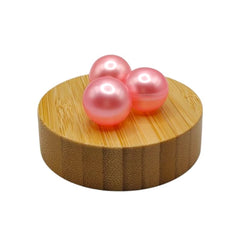 Tub scene with pink beads ready to soften and hydrate the skin.