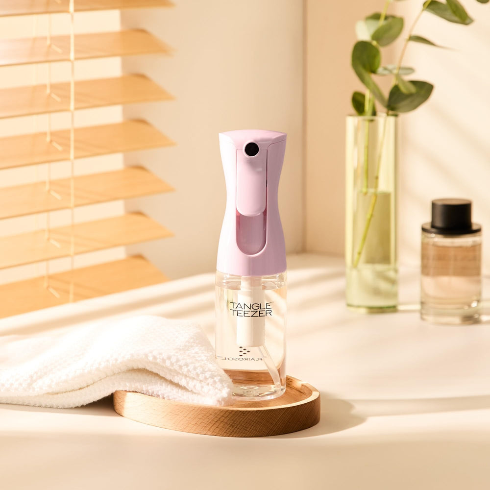 TANGLE TEEZER travel bottle pairs with detangler brushes for smoother results