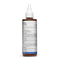 Tarsum psoriasis shampoo lather beside a towel for cleansing