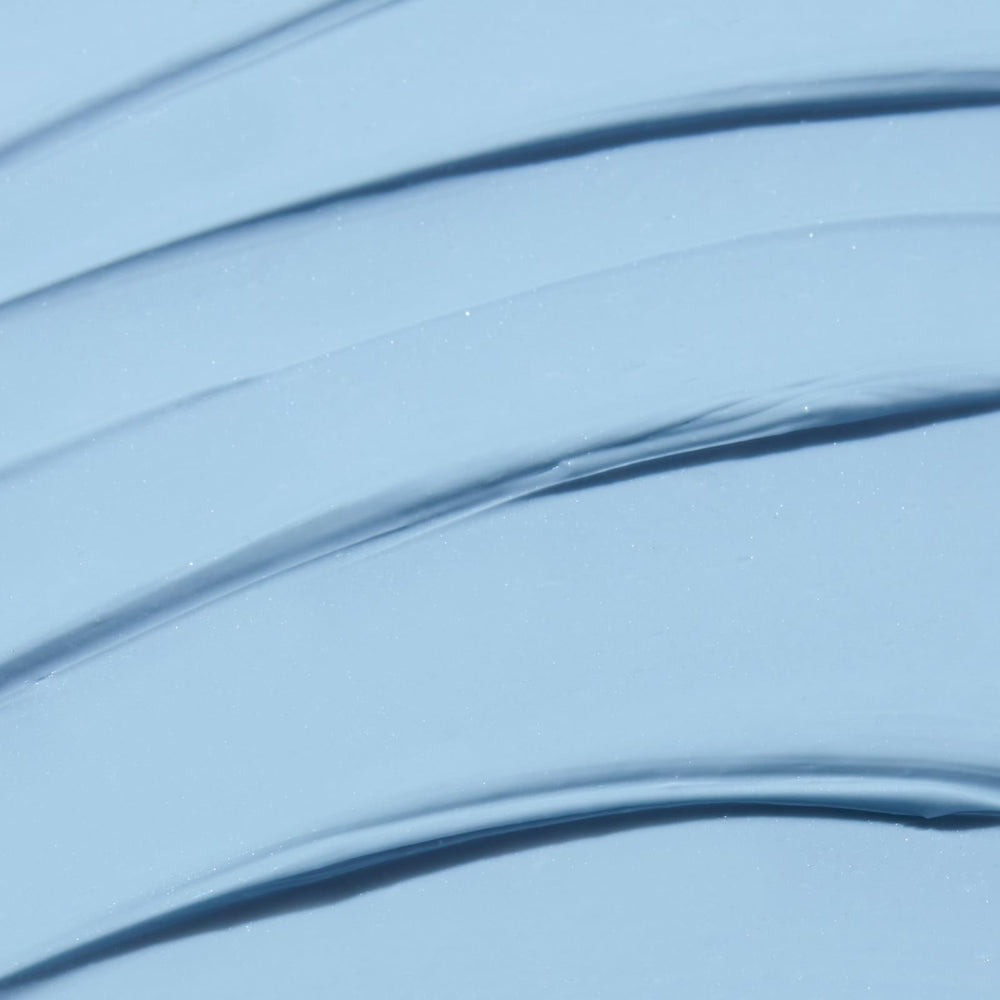 Close-up of Indigo Calming Cream texture showing creamy, soothing consistency.