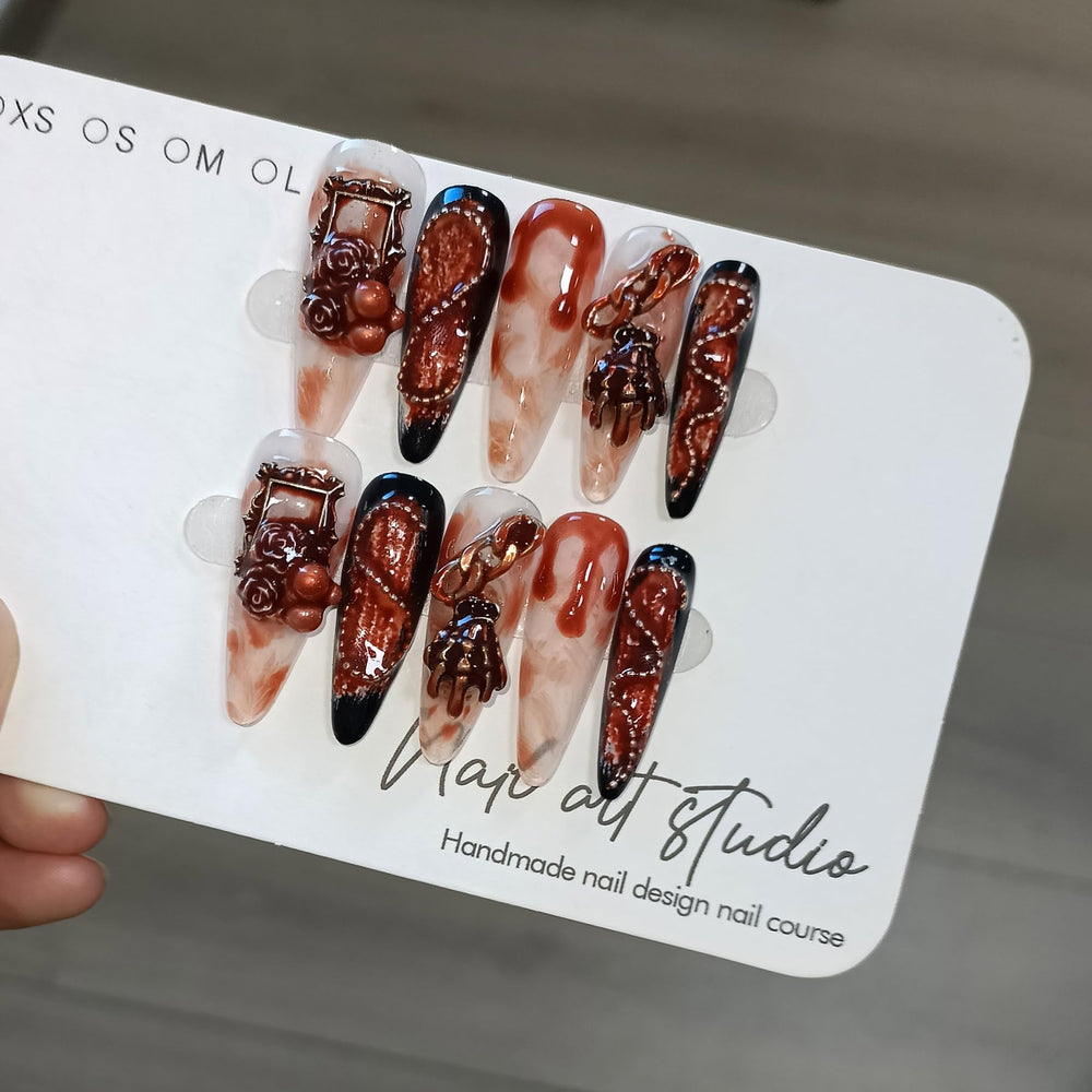 TENPAL nails featuring 3D distressed roses and skull art for bold style