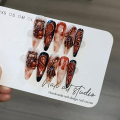 TENPAL nails featuring 3D distressed roses and skull art for bold style