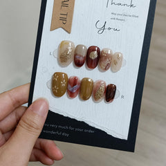TENPAL Amber Cat Eye Nails for a glam evening look.
