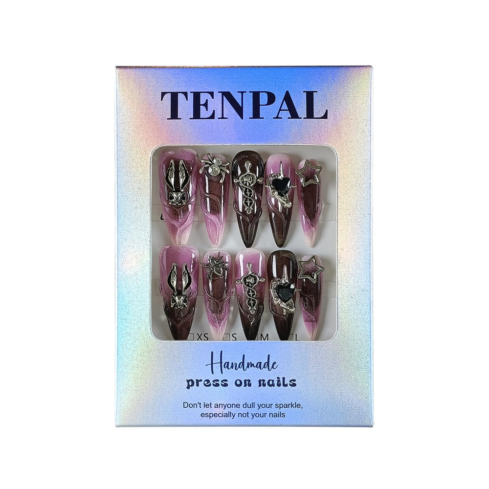 Close-up view of intricate charms and nail art by TENPAL