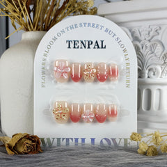 TENPAL hand-sculpted flowers detail on nails for elegant style.