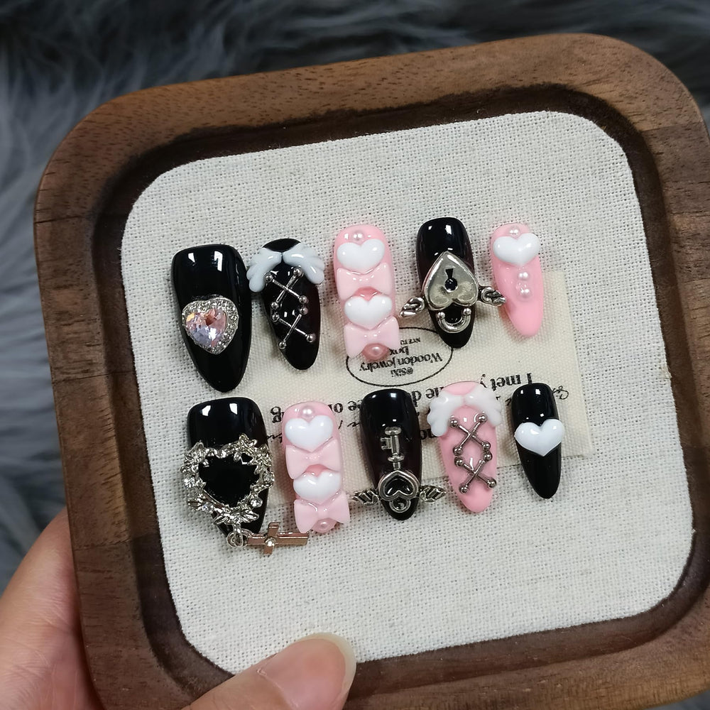 TENPAL Y2K press-on nails in ebony and pink almond with a glossy finish