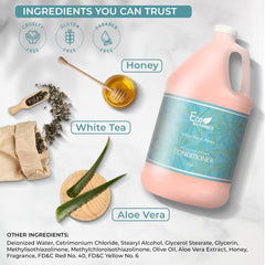 A close-up of the Terra Pure conditioner label highlights honey and white tea notes for hotel bathrooms.