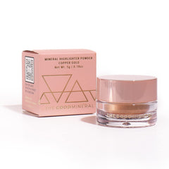 The Good Mineral Copper Gold highlighter on skin for subtle radiance.