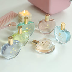 The Heart Company Valentine's Love 75ml bottle sits gracefully on a vanity.