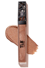 Close-up of The Lip Bar Goddess gloss tube with golden bronze shimmer and smooth glide.