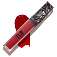 The Lip Bar Hot Mama lipstick application close-up for bold color.