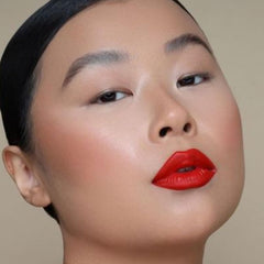 The Lip Bar packaging in hand conveys premium, easy-to-use lipstick.