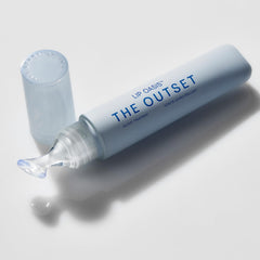 The Outset Lip Oasis glossy-finish applicator demonstrates a non-sticky, luxurious texture.