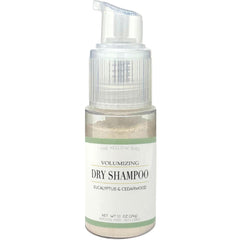 The Yellow Bird dry shampoo pump-action bottle for a quick hair refresh.