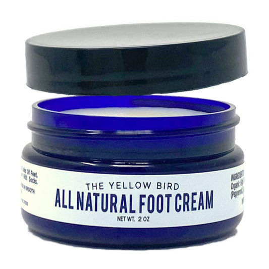 The Yellow Bird foot cream tub ready for hydrating daily foot care.