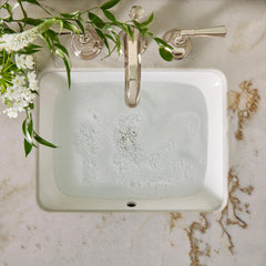 Thymes botanically-inspired packaging complements spa-like bathroom aesthetics.