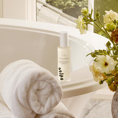 Thymes Eucalyptus Shower Spray label close-up shows premium ingredients.