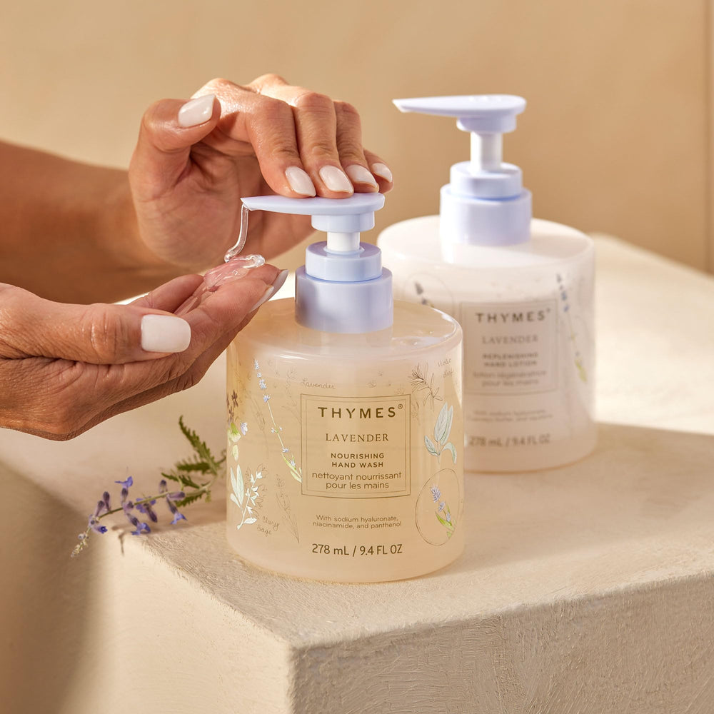 Glass bottle displayed on a bathroom shelf for Thymes hand wash
