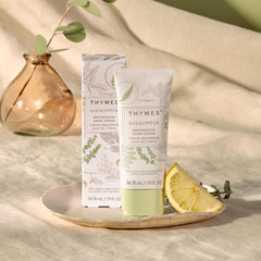 Close-up of Thymes Restorative Hand Cream label showing fragrance and vegan formula