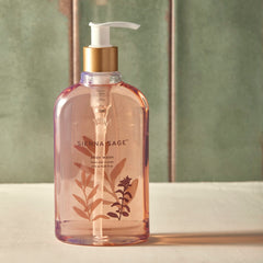 Thymes Sienna Sage bottle close-up highlights fragrance-rich lather for cleansing.