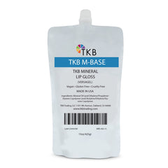 TKB Mineral Lip Gloss M-Base bottle pour shows a crystal-clear base for easy gloss creation.