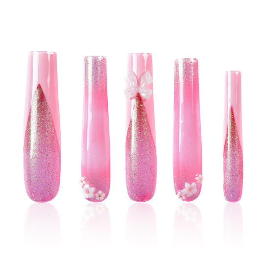 Tmani extra-long ballet-square nails with crystal glitter for a party-ready look.