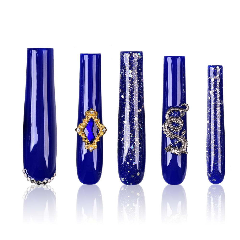 Tmani extra-long press-on nails with crystal glitter for dramatic party looks.