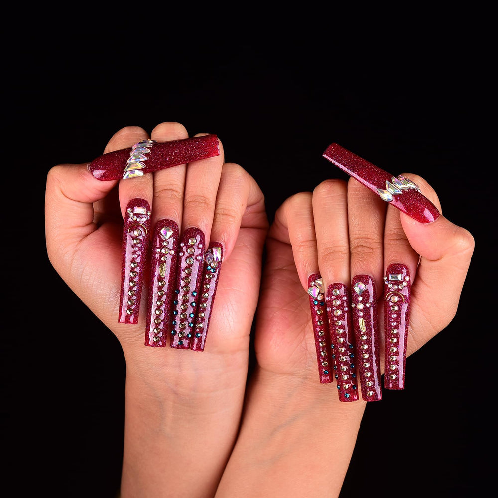 Tmani handmade nails with crystal accents offer unique style.