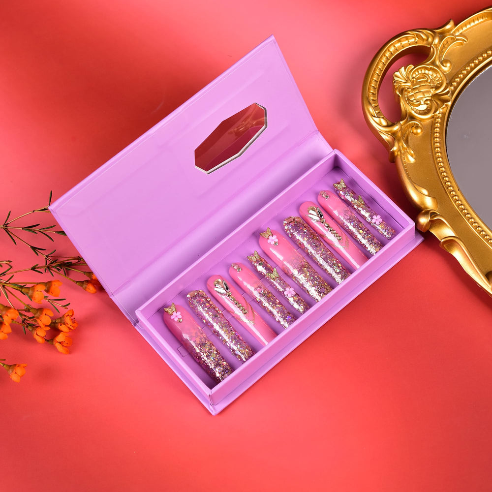 Tmani press-on nails shown with file and glue for quick at-home manicure.